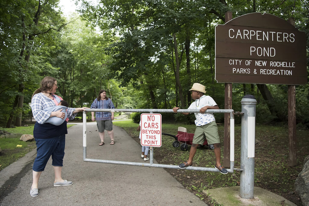family playing in the park during their Day in the Life family session in Scarsdale, New York