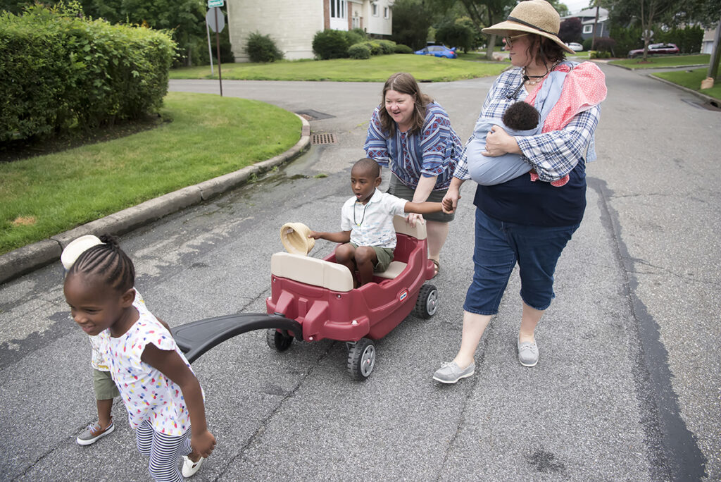 family on a walk during their Day in the Life family session in Scarsdale, New York