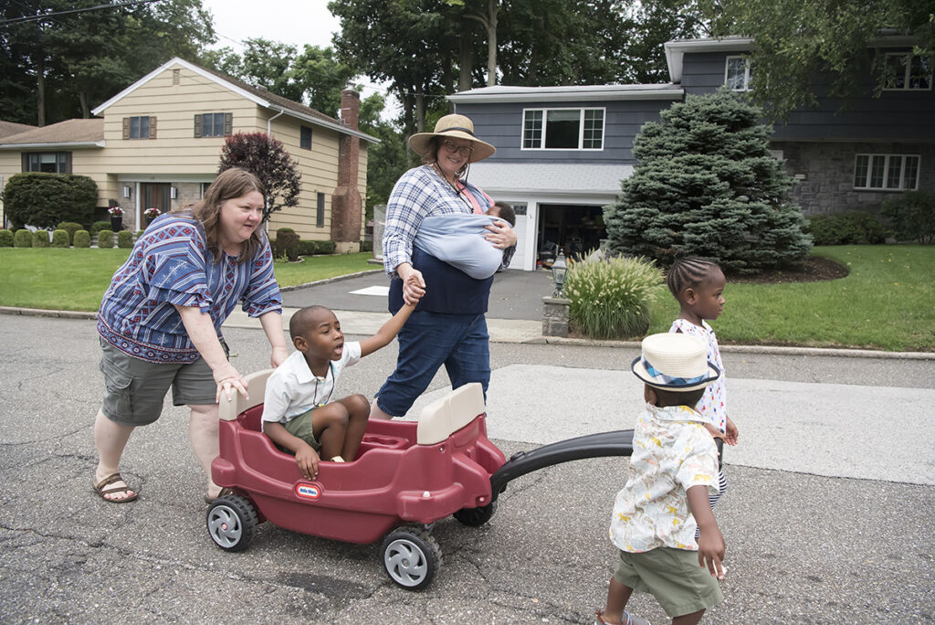 family on a walk during their Day in the Life family session in Scarsdale, New York