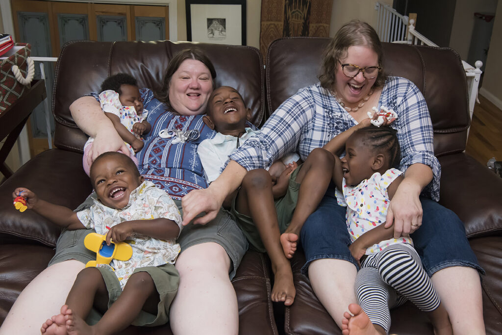 family laughing together during their Day in the Life family session in Scarsdale, New York