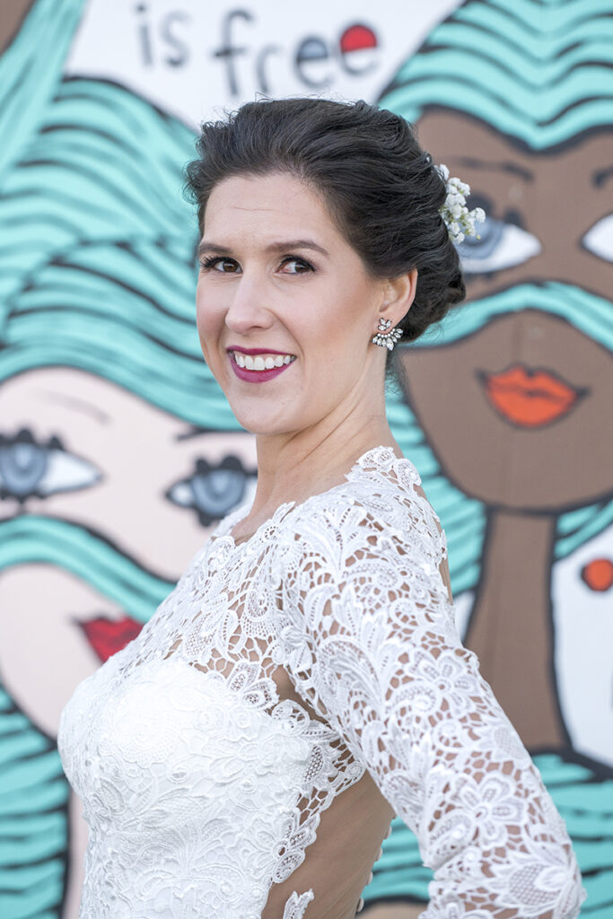 bride in front of Asbury Park murals on their wedding day in Asbury Park.