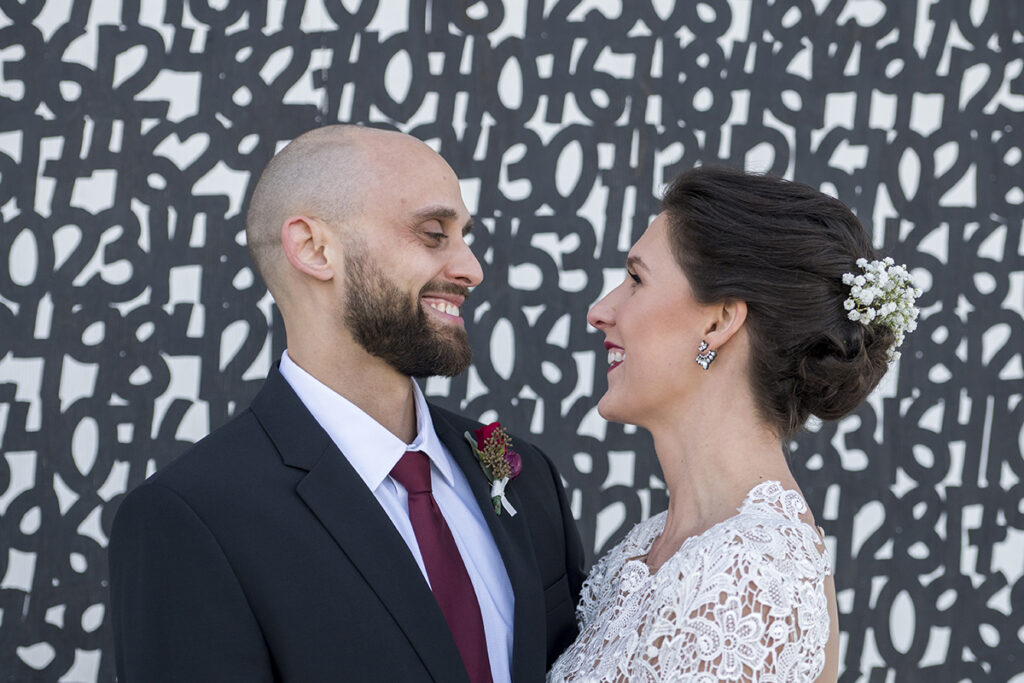 bride and groom in front of Asbury Park murals on their wedding day in Asbury Park.