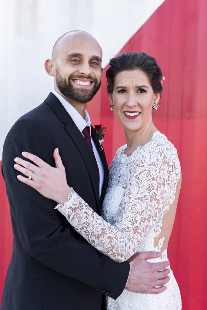 bride and groom in front of Asbury Park murals on their wedding day in Asbury Park.