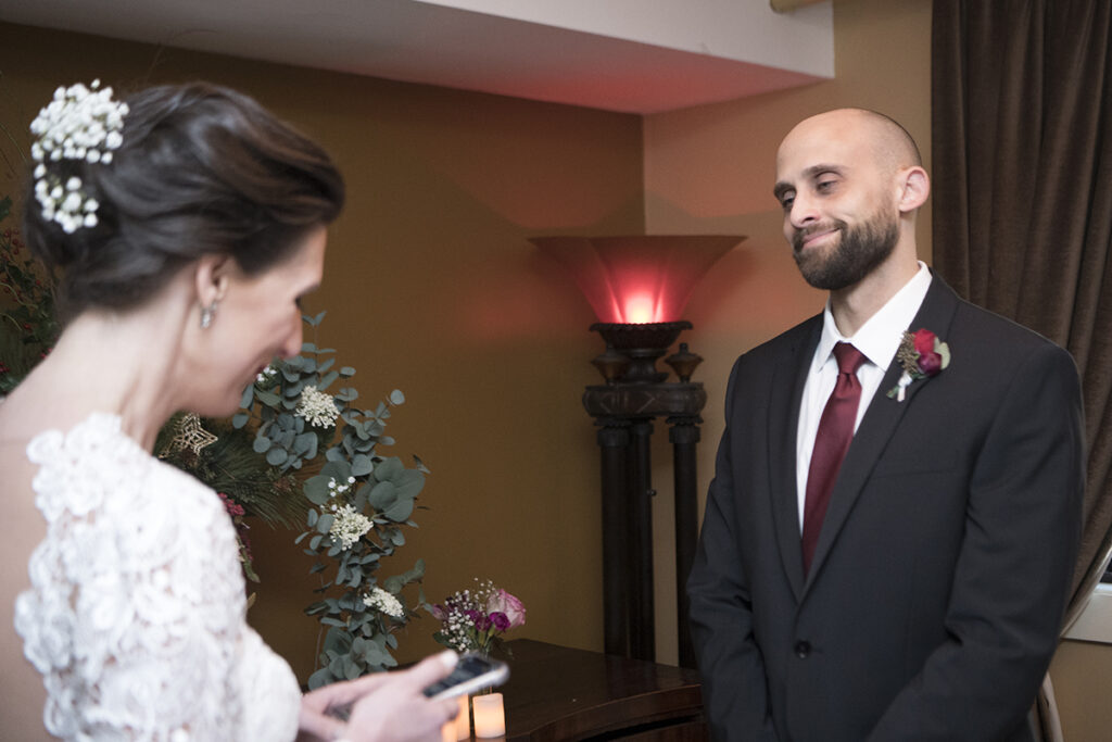 bride and groom during wedding ceremony on wedding day at  Moonstruck in Asbury Park