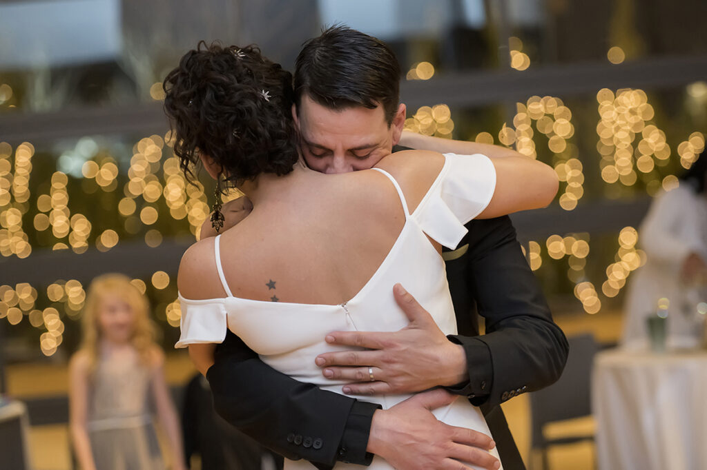 bride and groom dance their first dance at wedding reception on wedding day at The Asbury Hotel in Asbury Park