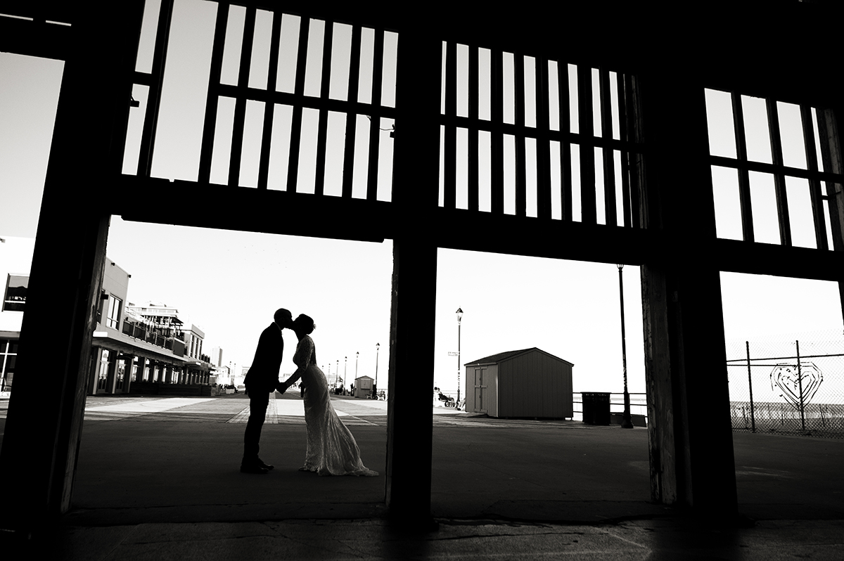 bride and groom kissing at Asbury Park Casino on their wedding day in Asbury Park.