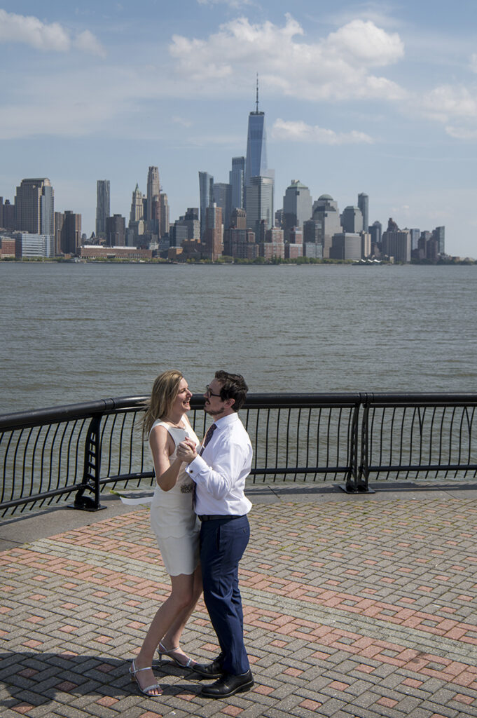Couple dances their first dance after their micro wedding on Pier A in Hoboken