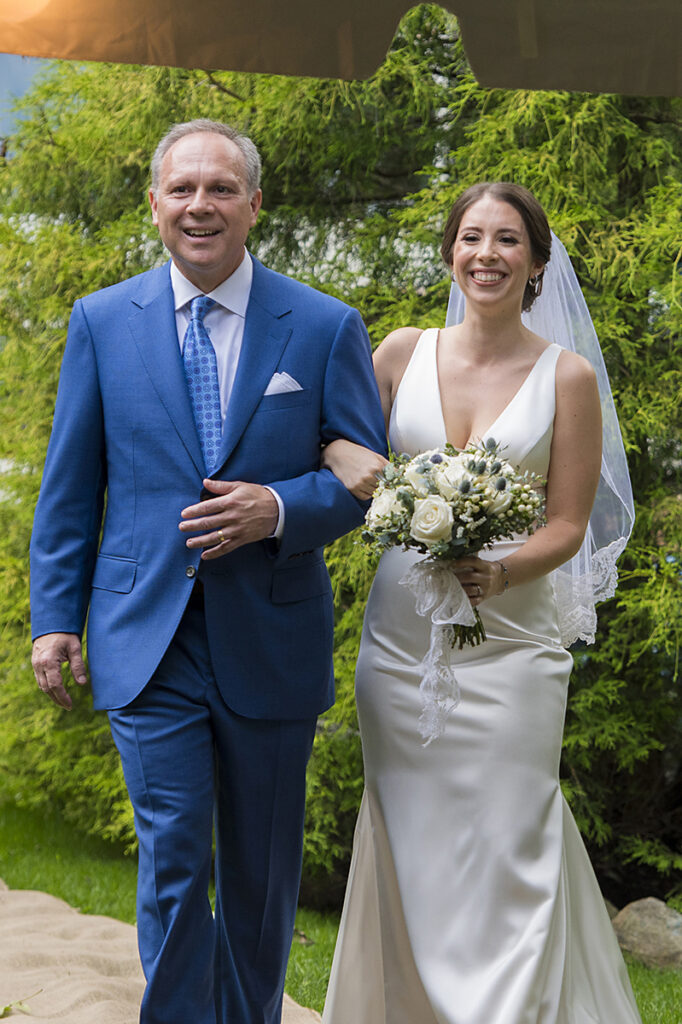 bride and her father walking down the aisle on wedding day