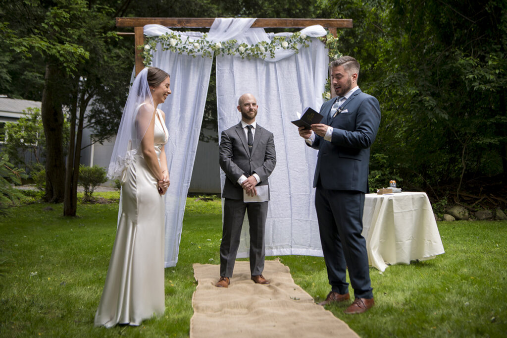 bride and groom exchanging wedding vows on their wedding day in New York