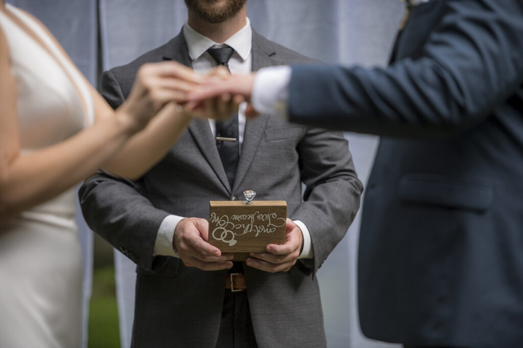 bride and groom exchanging rings on their wedding day in New York