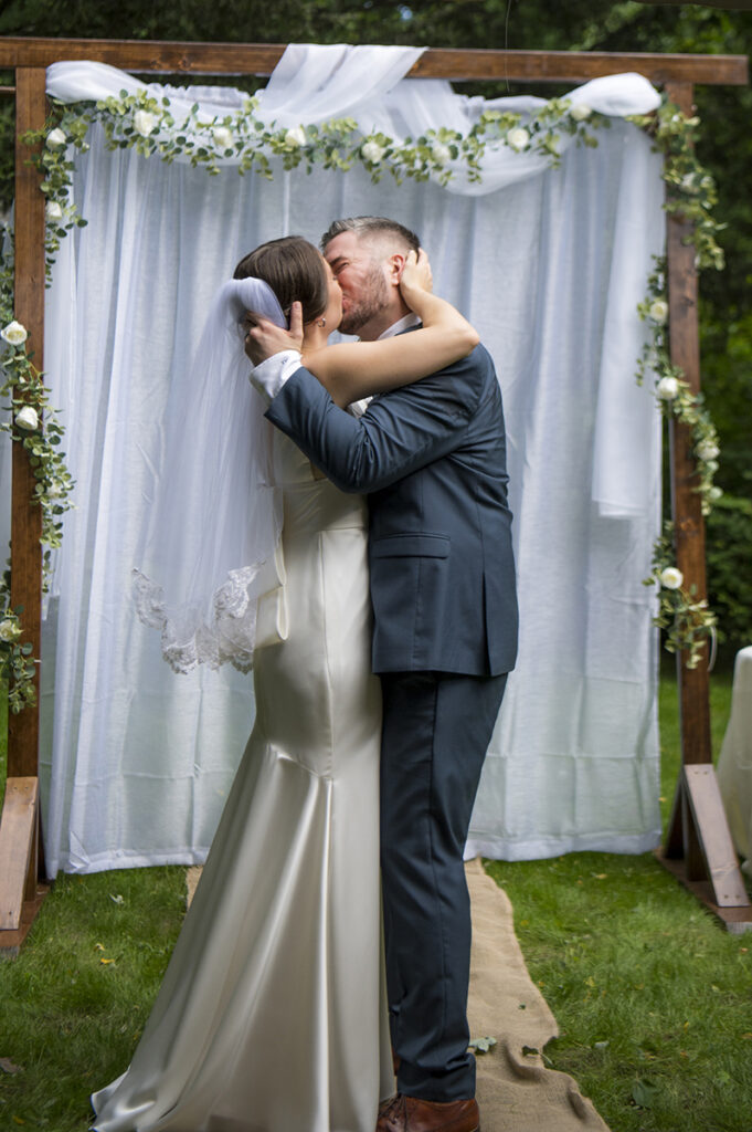 bride and groom kissing on their wedding day in New York