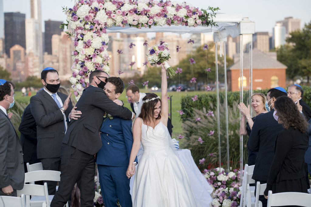 bride and groom at conclusion of wedding ceremony at Liberty House in Jersey City