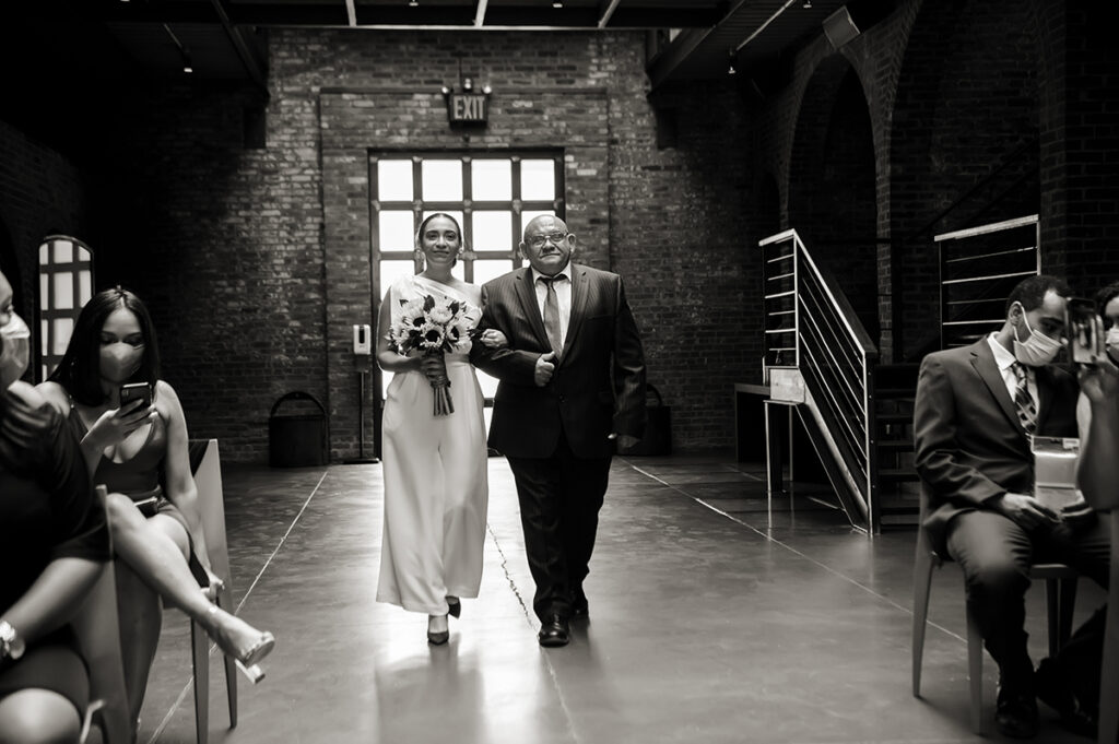 bride and father walking down the aisle at wedding ceremony at The Foundry in Long Island City