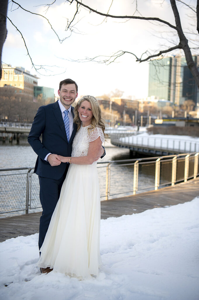 happy Hoboken wedding couple on their wedding day in Hoboken in the snow