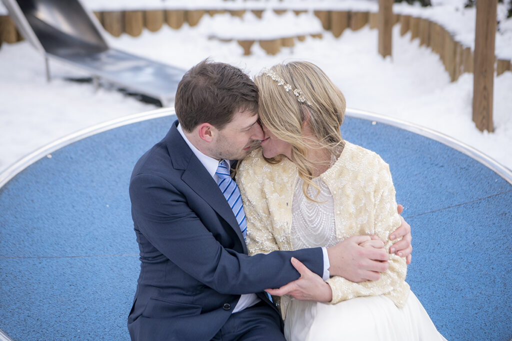 happy Hoboken wedding couple on their wedding day in Hoboken in the snow