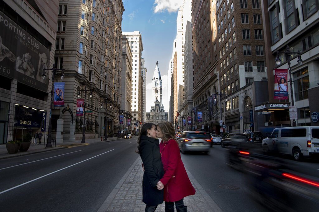 LGBTQ couple kissing in front of City Hall during their Philadelphia Engagement Session