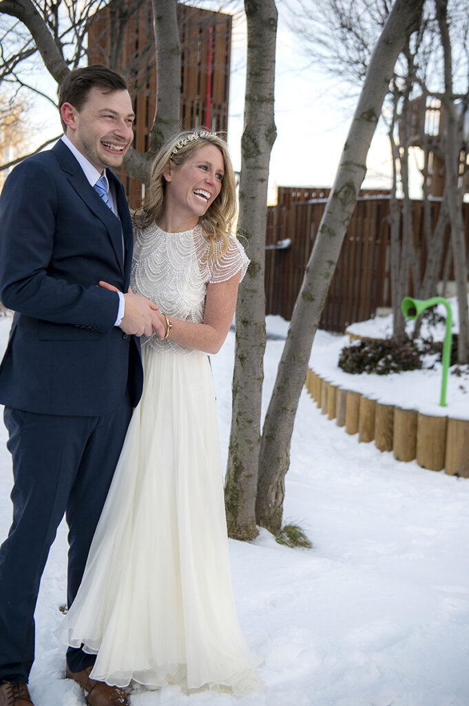 bride and groom smile on their wedding day in Hoboken