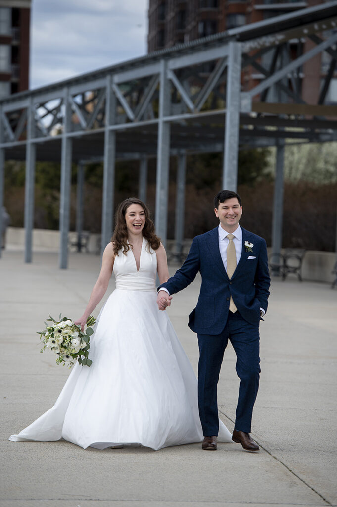 bride and groom walking to Hoboken waterfront for their wedding ceremony