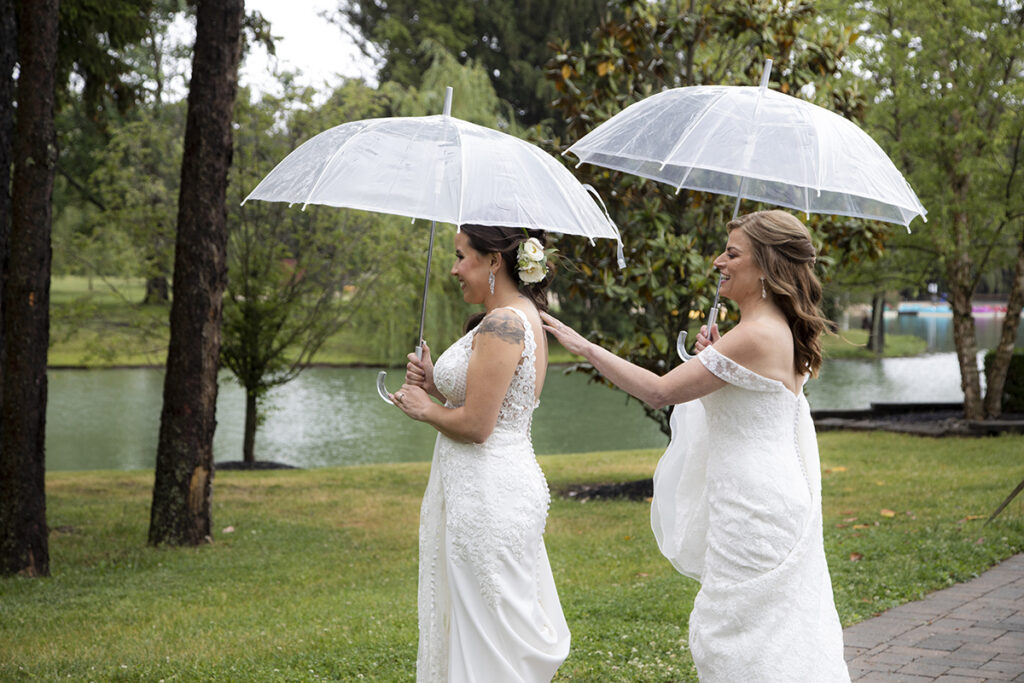 brides having their first look on wedding day at Windows on the Water at Frogbridge. LGBTQ wedding