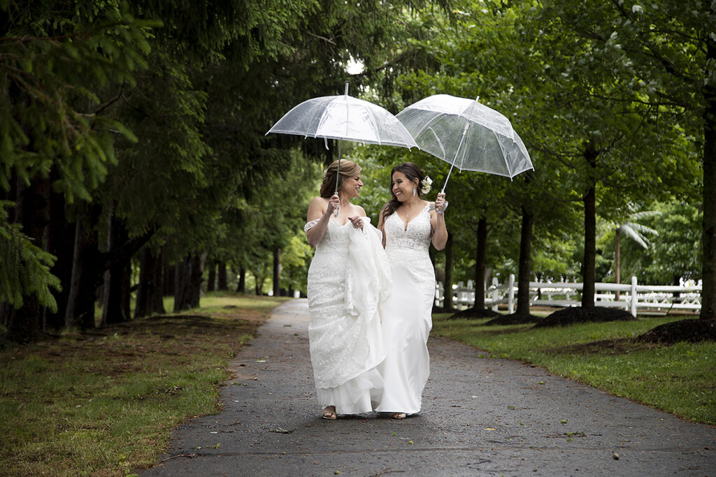 brides on wedding day at Windows on the Water at Frogbridge. LGBTQ wedding