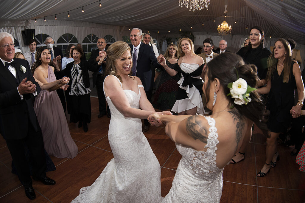 hora at wedding reception on wedding day at Windows on the Water at Frogbridge. LGBTQ wedding