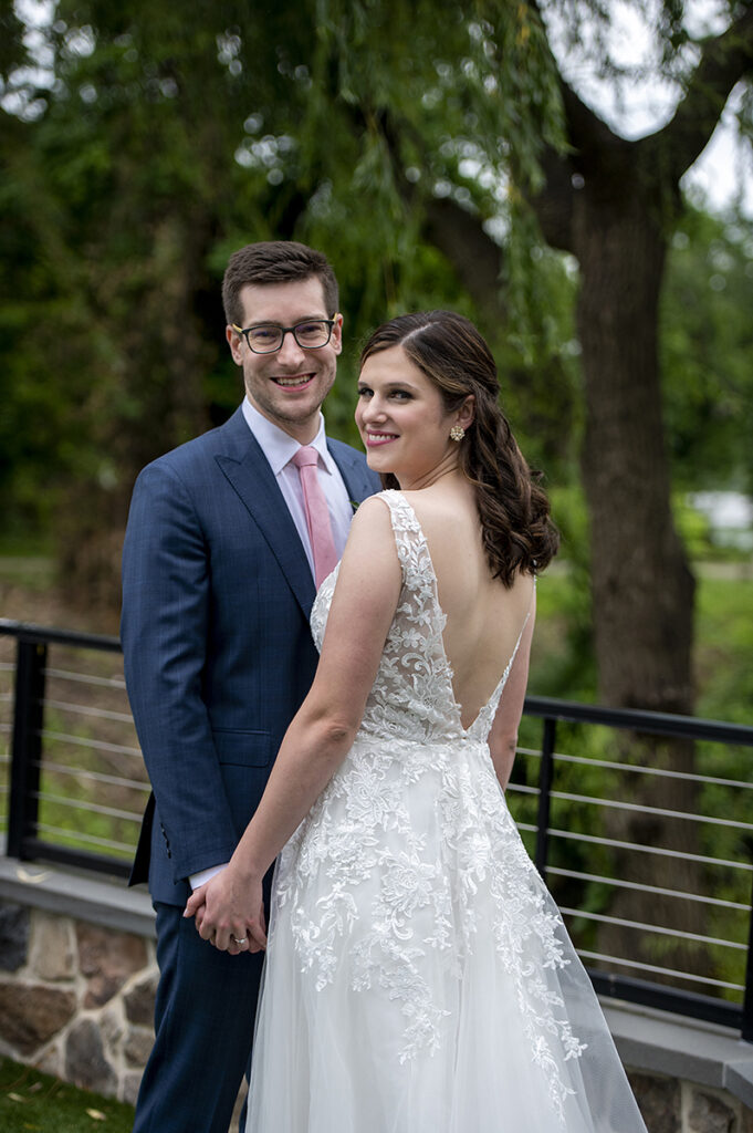 bride and groom on wedding day at River House at Odette’s in New Hope.