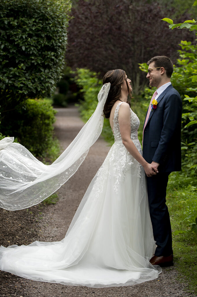 bride and groom on wedding day at River House at Odette’s in New Hope.