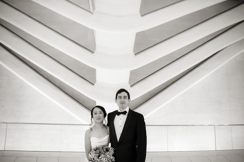bride and groom at the oculus on their wedding day