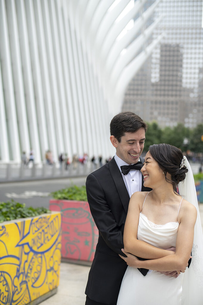 bride and groom at the oculus on their wedding day