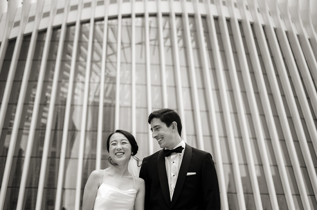 bride and groom at the oculus on their wedding day