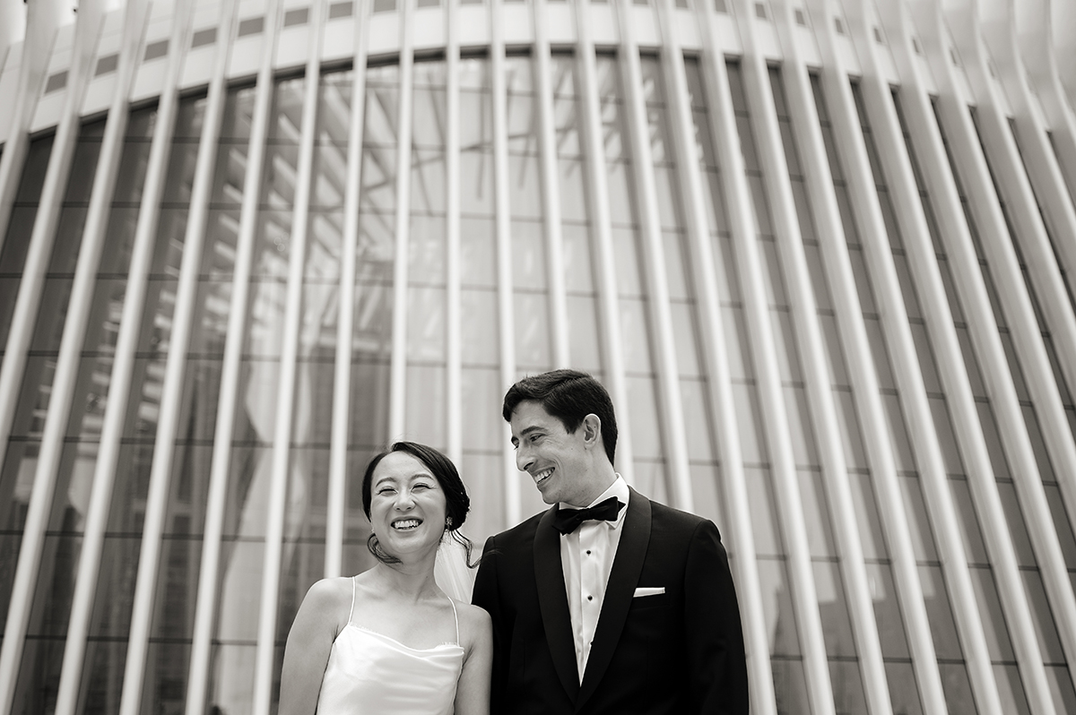 bride and groom at the oculus on their wedding day