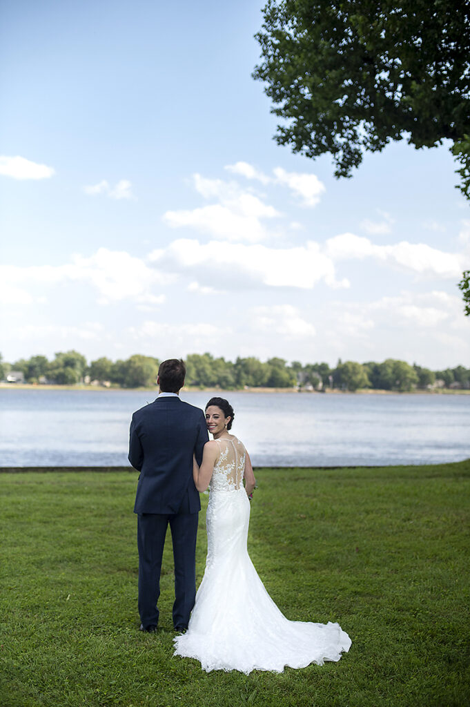 bride and groom along the river on their wedding day at Belle Voir Manor at Pen Ryn Estate