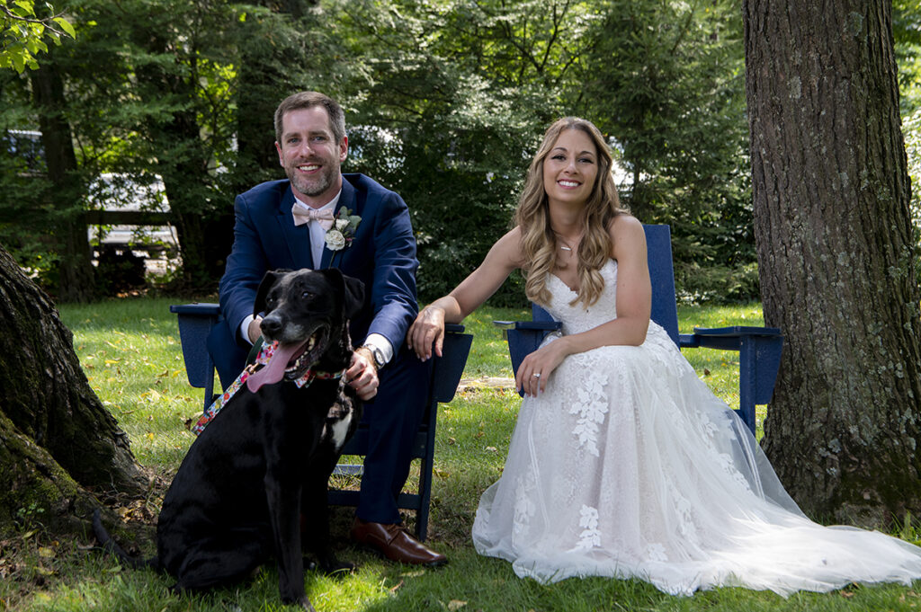 bride and groom with their dog on their wedding day at Hotel du Village wedding