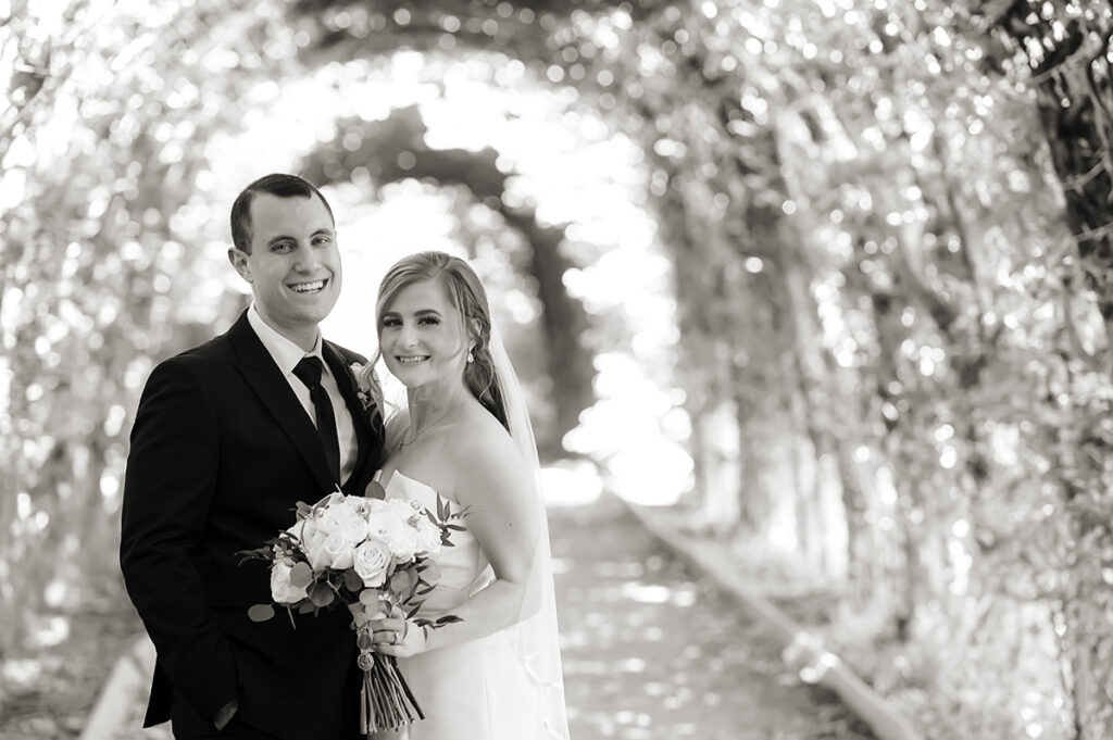 bride and groom on their wedding day at Celebrate at Snug Harbor botanical gardens