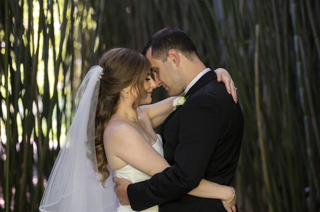 bride and groom on their wedding day at Celebrate at Snug Harbor botanical gardens