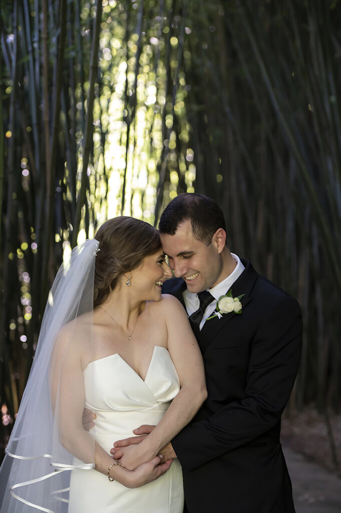bride and groom on their wedding day at Celebrate at Snug Harbor botanical gardens