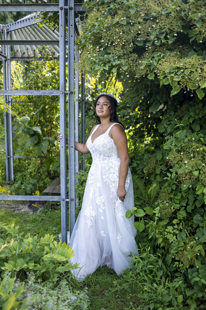bride poses for portraits after their intimate Queens Botanical Garden wedding