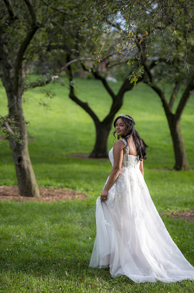 bride poses for portraits after their intimate Queens Botanical Garden wedding