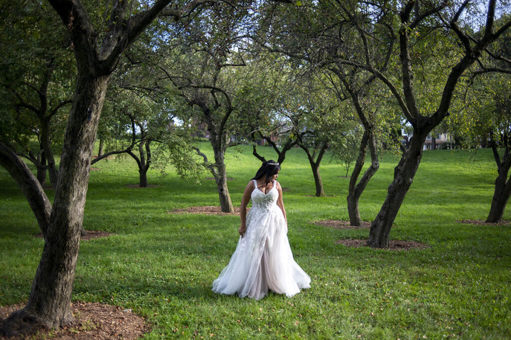 bride poses for portraits after their intimate Queens Botanical Garden wedding