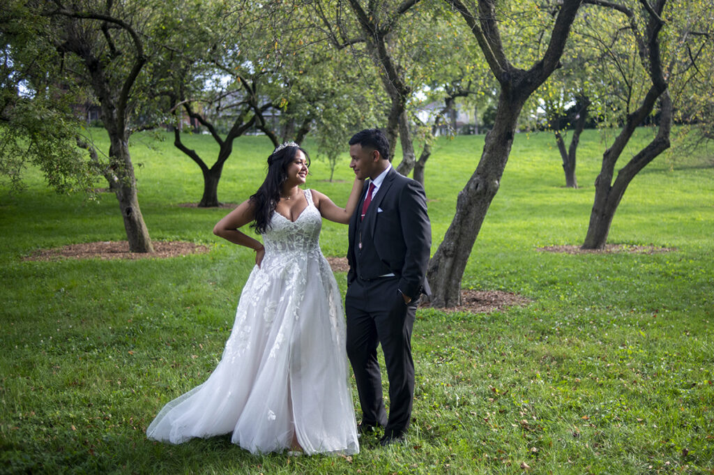 bride and groom pose for portraits after their intimate Queens Botanical Garden wedding