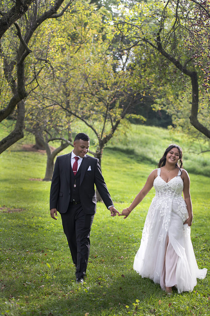 bride and groom pose for portraits after their intimate Queens Botanical Garden wedding