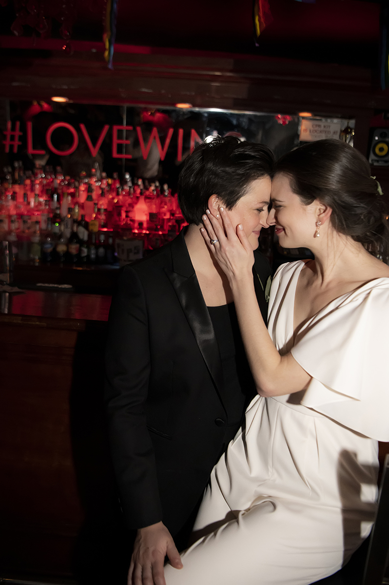 2 brides wedding portraits at Stonewall Inn in NYC. LGBTQ wedding