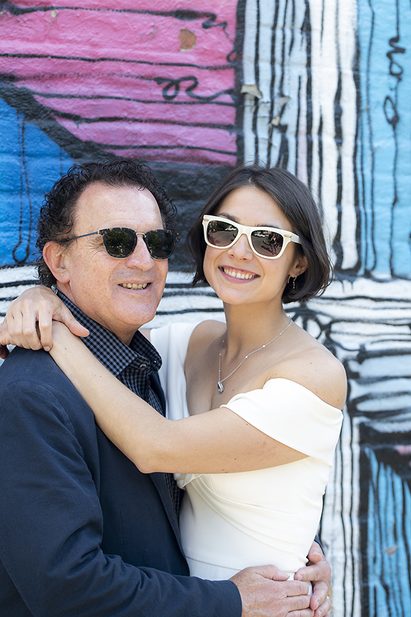 bride and groom with mural at Jersey City elopement