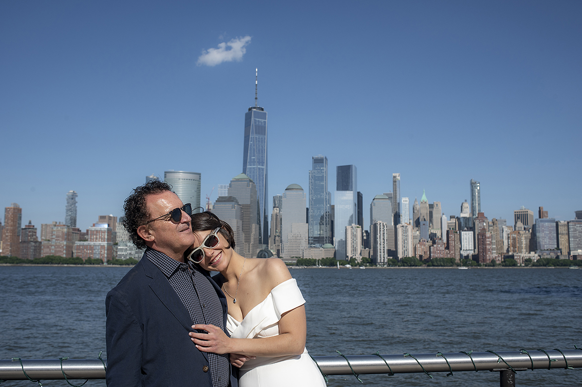 bride and groom with NYC skyline at Jersey City elopement