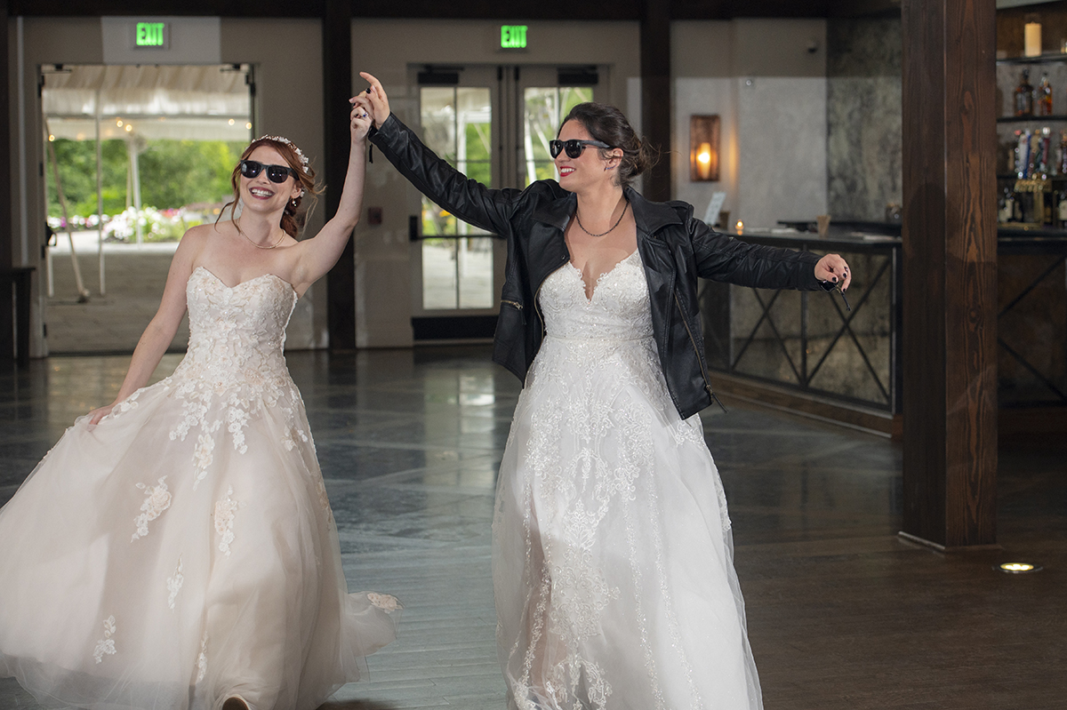 brides enter their reception at Crossed Keys Estate Wedding