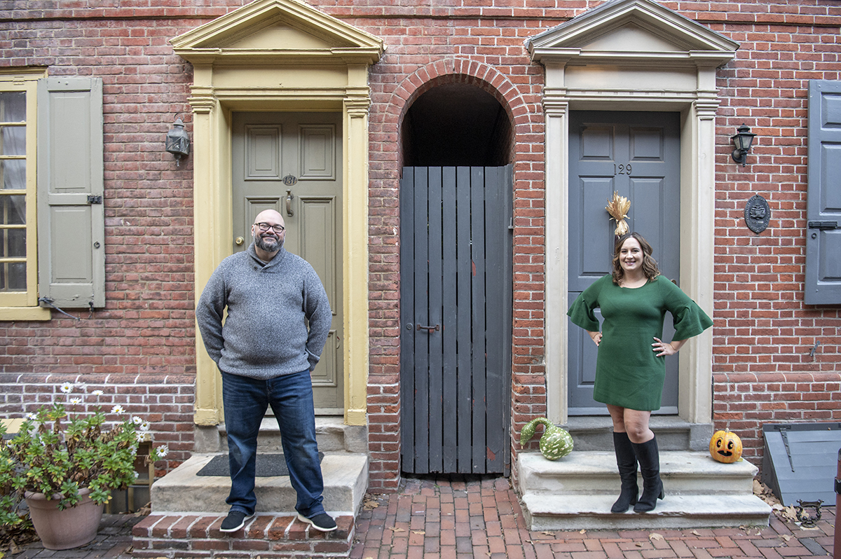 couple posing on Elfreths Alley in Philadelphia for their Old City Philly engagement session