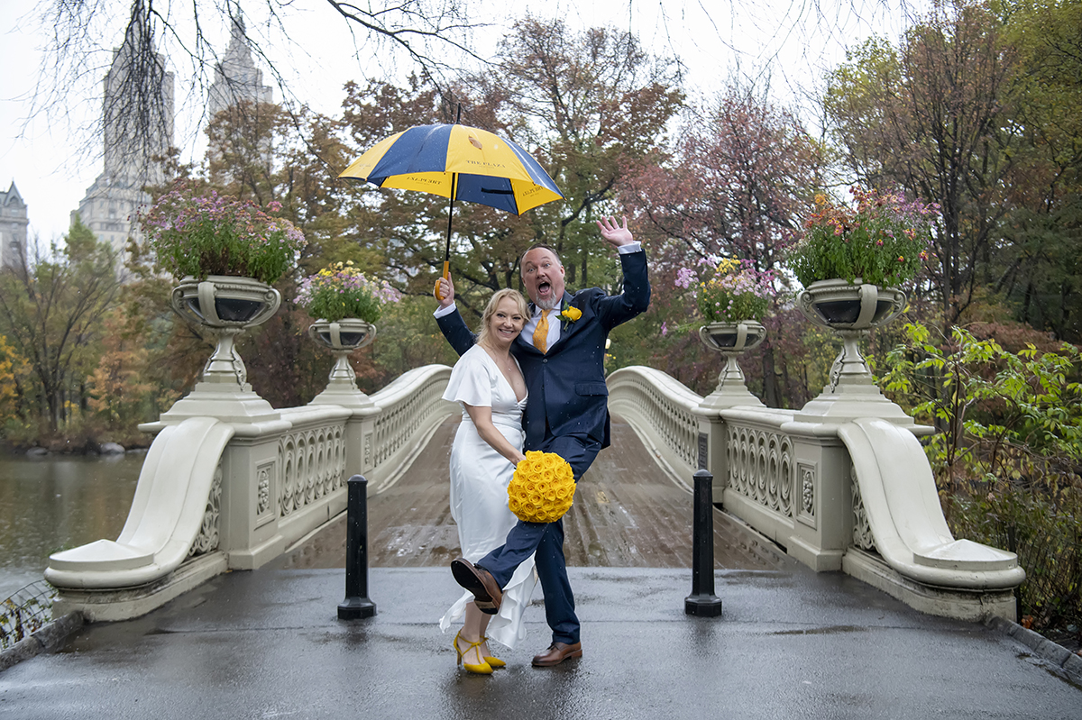 bride and groom in rain on their wedding day in Central Park, NYC