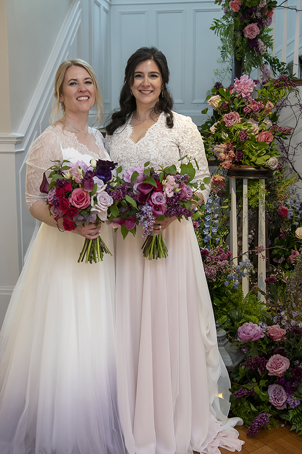 Two brides pose for portraits at Reeves-Reed Arboretum Wedding | LGBTQ wedding photographer