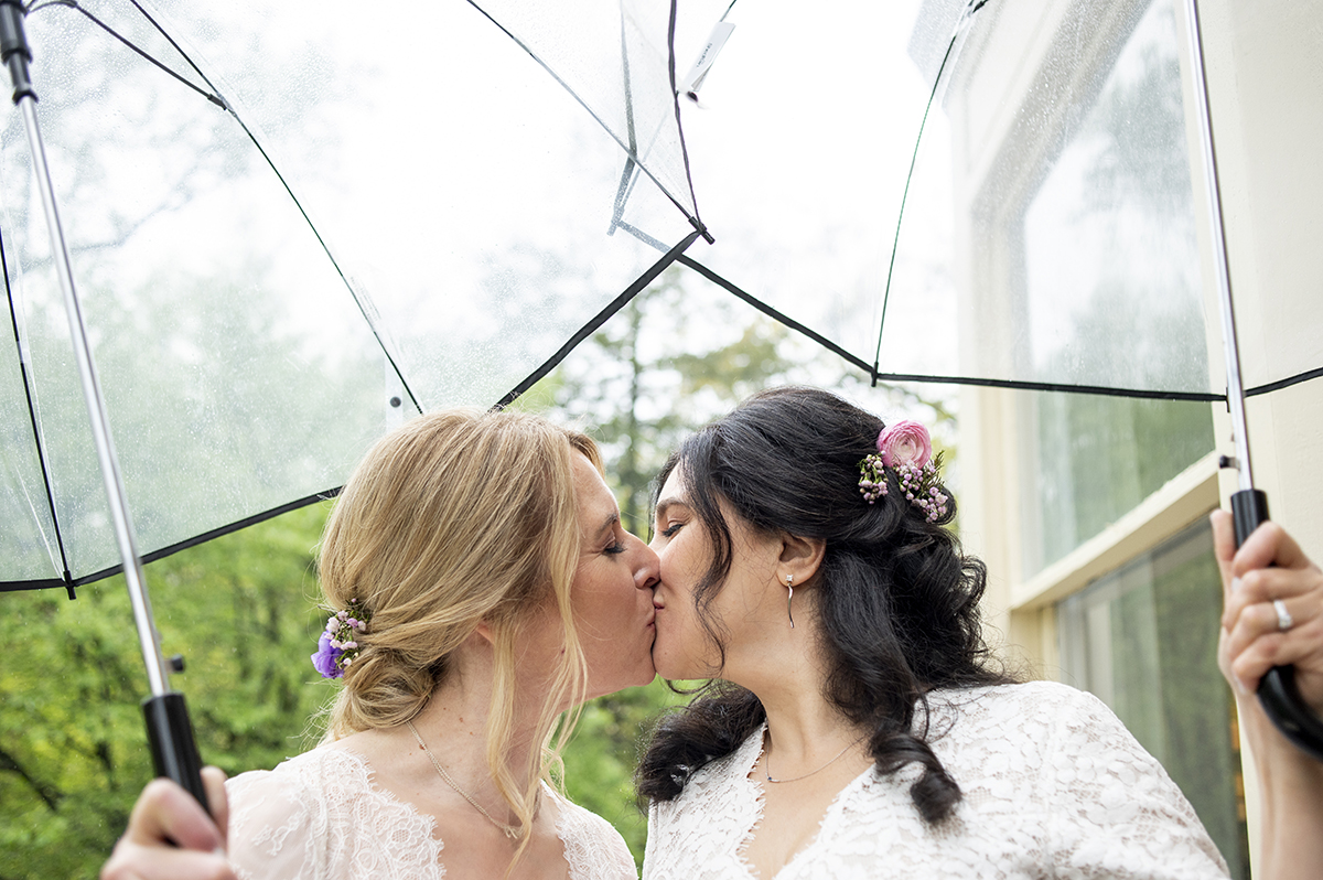 Two brides pose for portraits at Reeves-Reed Arboretum Wedding | LGBTQ wedding photographer