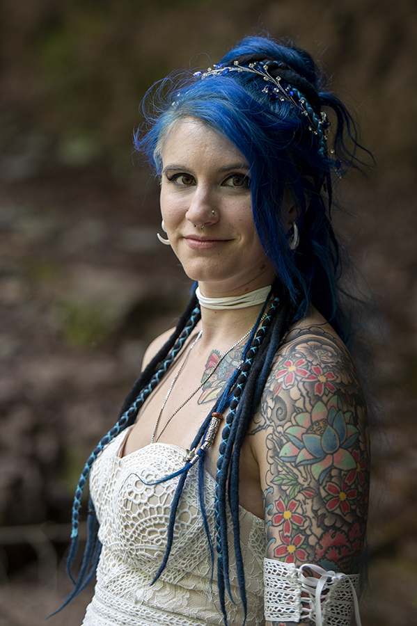 brides at waterfall in the forest on their wedding day at Riedlbauer’s Resort in the Catskills. LGBTQ wedding